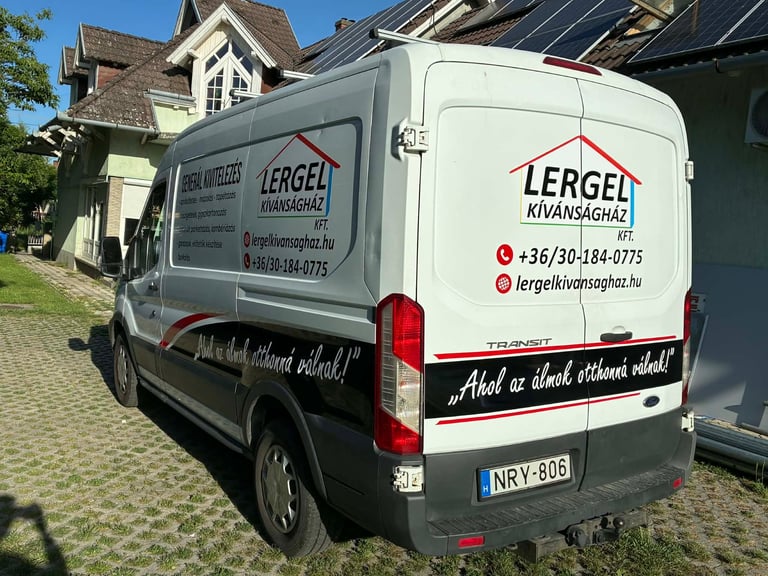 White Lergel moving company van parked in front of a residential house